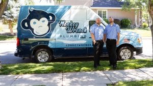 Two service men standing in front of service van-plumbers in Salt Lake City-